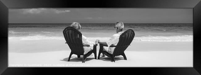 Panoramic senior couple enjoying tranquility on tropical island Framed Print by Spotmatik 