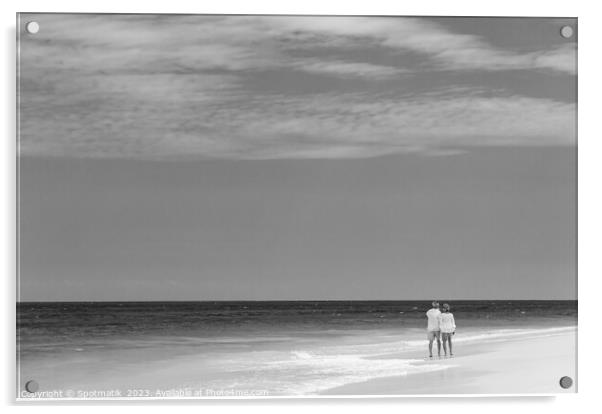 Retired couple walking barefoot by turquoise ocean Bahamas Acrylic by Spotmatik 