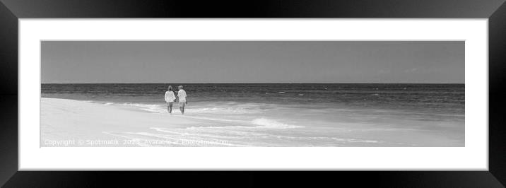 Panoramic retired couple by ocean at island resort Framed Mounted Print by Spotmatik 