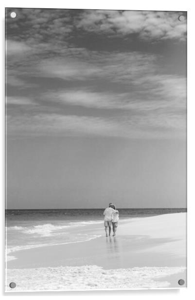 Retired couple walking by ocean in loving embrace Acrylic by Spotmatik 