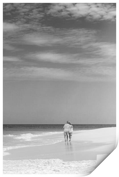 Retired couple walking by ocean in loving embrace Print by Spotmatik 