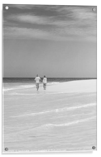 Mature couple walking on beach by ocean Bahamas Acrylic by Spotmatik 