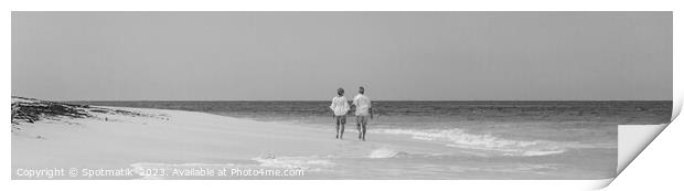 Panoramic view mature couple walking on beach Bahamas Print by Spotmatik 