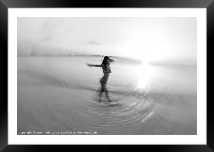 Motion blurred sunset ocean view with dancing female Framed Mounted Print by Spotmatik 