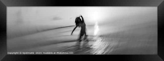 Panoramic ocean sunset with dancing female motion blur Framed Print by Spotmatik 