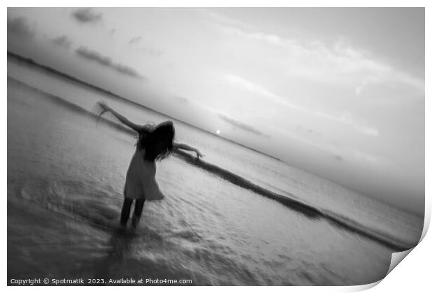 Motion blur girl standing in ocean at sunrise Print by Spotmatik 