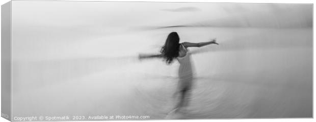 Motion blurred panoramic ocean sunset with dancing girl Canvas Print by Spotmatik 