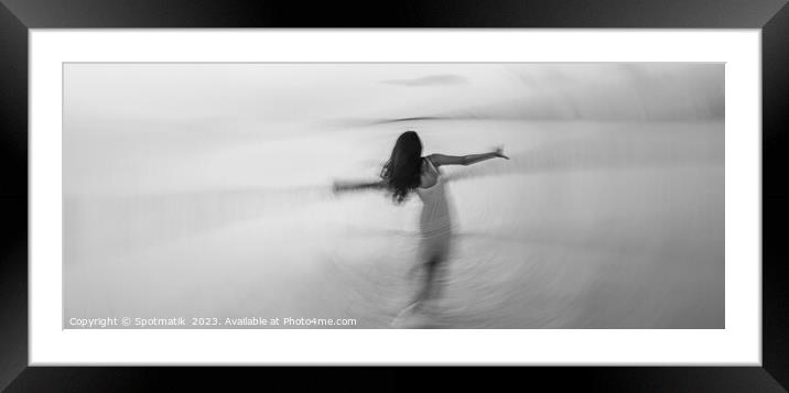 Motion blurred panoramic ocean sunset with dancing girl Framed Mounted Print by Spotmatik 