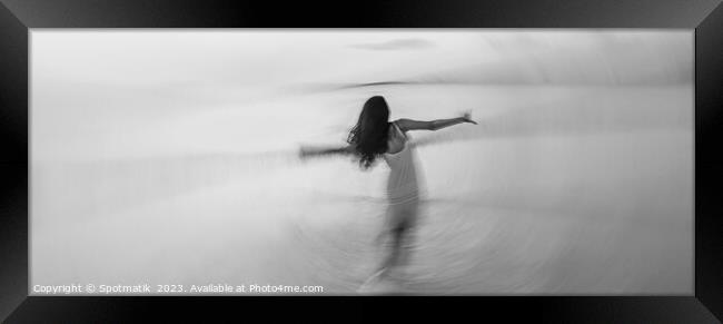 Motion blurred panoramic ocean sunset with dancing girl Framed Print by Spotmatik 