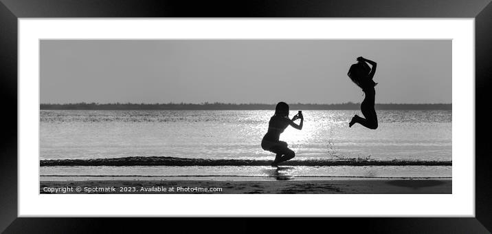 Panoramic ocean sunrise with girl jumping for photo Framed Mounted Print by Spotmatik 