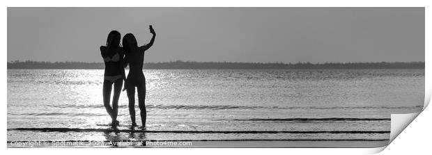 Panoramic ocean sunrise with females silhouette taking selfie Print by Spotmatik 