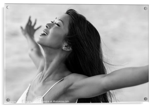 Asian girl enjoying freedom outdoors by the ocean Acrylic by Spotmatik 