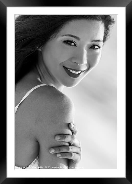 Portrait of smiling Asian girl on relaxing vacation Framed Mounted Print by Spotmatik 