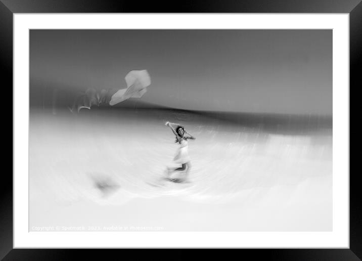 Motion blurred young woman flying kite on beach Framed Mounted Print by Spotmatik 
