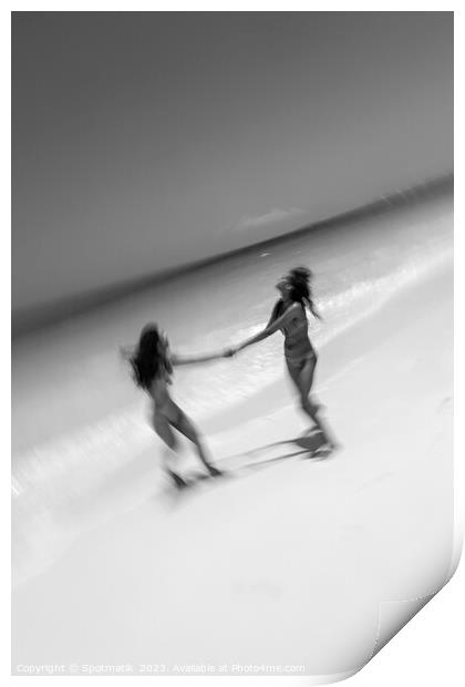 Motion blurred women in swimwear playing by ocean Print by Spotmatik 