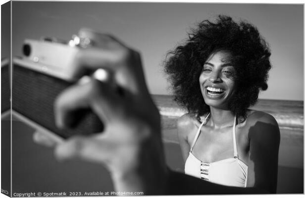 Laughing African American girl taking selfie on beach Canvas Print by Spotmatik 