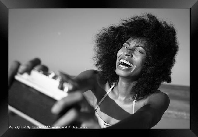 Afro girl laughing at camera taking fun selfie Framed Print by Spotmatik 