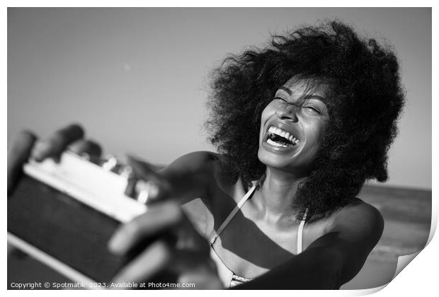 Afro girl laughing at camera taking fun selfie Print by Spotmatik 