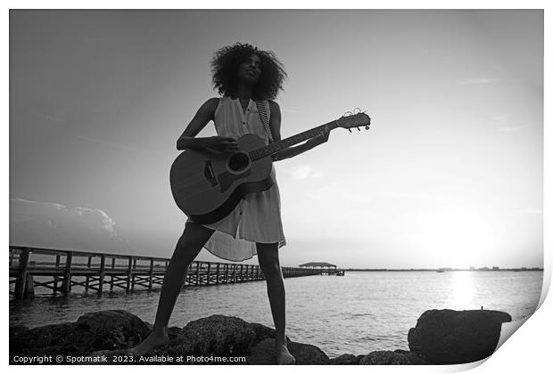 Young African American woman playing guitar at sunrise Print by Spotmatik 