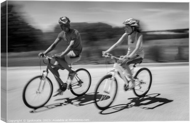 African American couple keeping fit riding bikes together Canvas Print by Spotmatik 