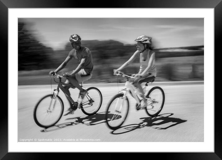 African American couple keeping fit riding bikes together Framed Mounted Print by Spotmatik 
