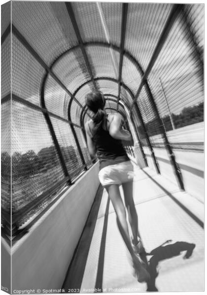 Young African American female jogging along arched walkway Canvas Print by Spotmatik 