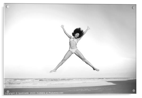 Healthy African American girl jumping high on beach Acrylic by Spotmatik 