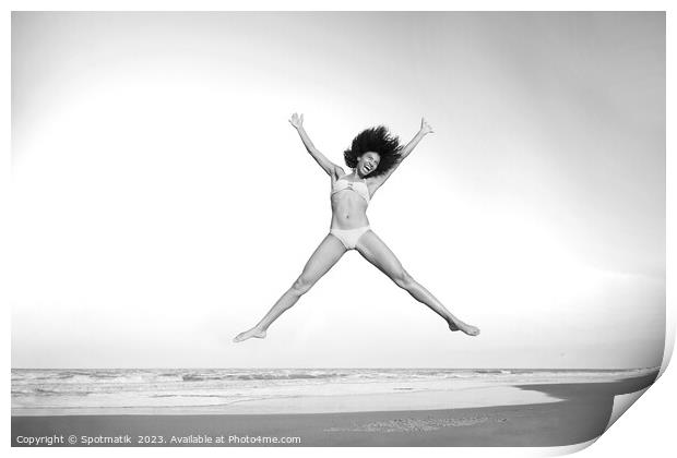 Healthy African American girl jumping high on beach Print by Spotmatik 