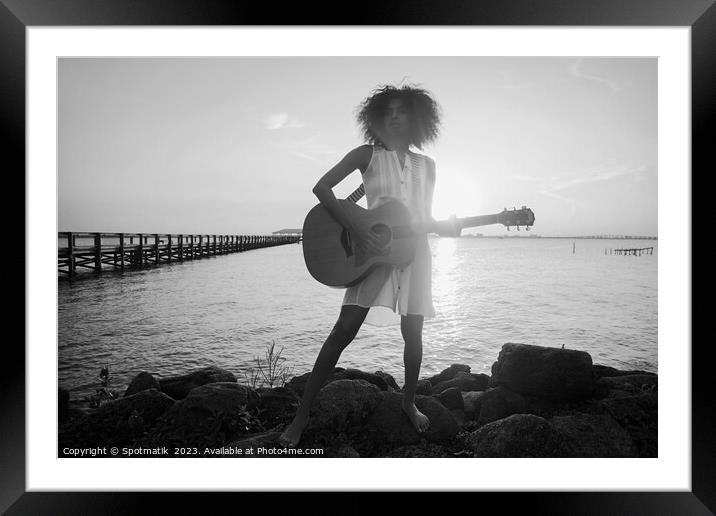 Afro American girl playing guitar with ocean sunset Framed Mounted Print by Spotmatik 