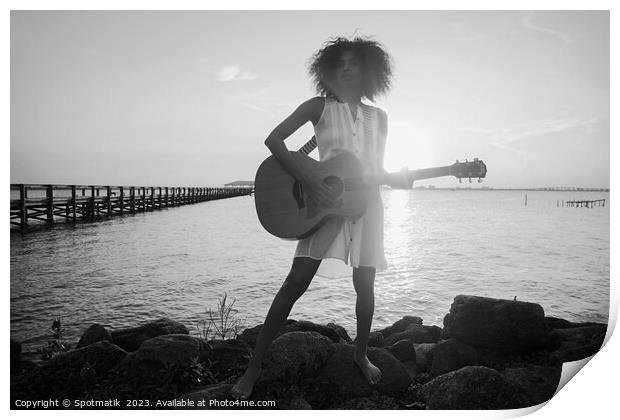 Afro American girl playing guitar with ocean sunset Print by Spotmatik 