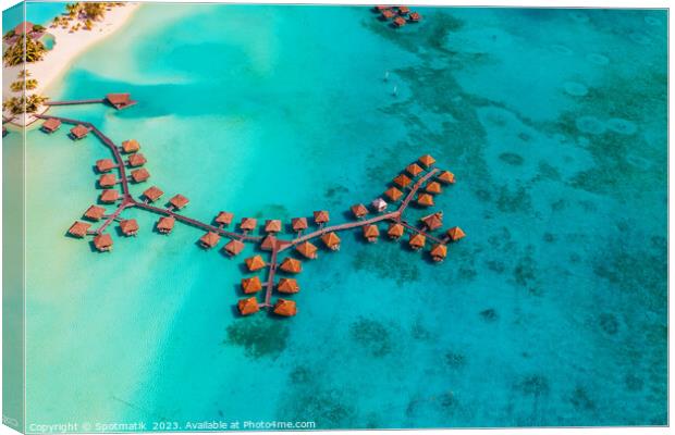 Aerial luxury overwater bungalow resort Bora Bora lagoon  Canvas Print by Spotmatik 