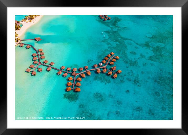 Aerial luxury overwater bungalow resort Bora Bora lagoon  Framed Mounted Print by Spotmatik 