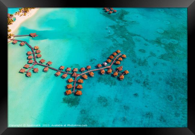 Aerial luxury overwater bungalow resort Bora Bora lagoon  Framed Print by Spotmatik 