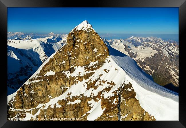 Aerial view of Switzerland mountain Peak cliff face Framed Print by Spotmatik 