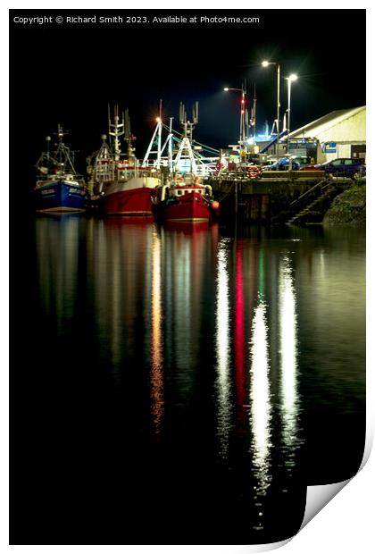 Fishing vessels moored to Portree pier at night Print by Richard Smith
