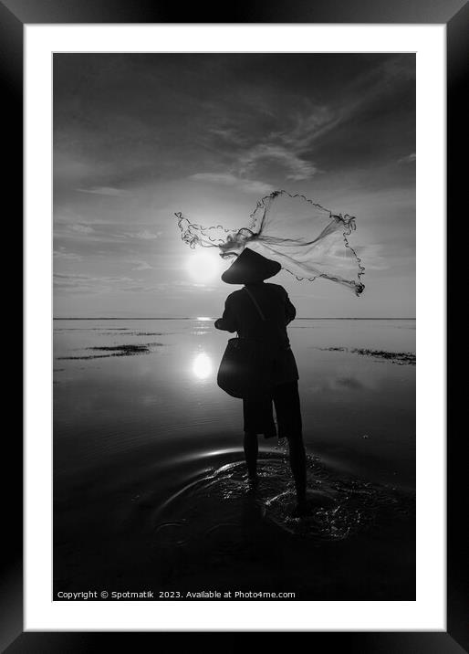 Balinese fisherman casting net Flores sea at sunrise Framed Mounted Print by Spotmatik 