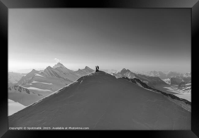 Aerial view Switzerland climbers on mountain summit Europe Framed Print by Spotmatik 