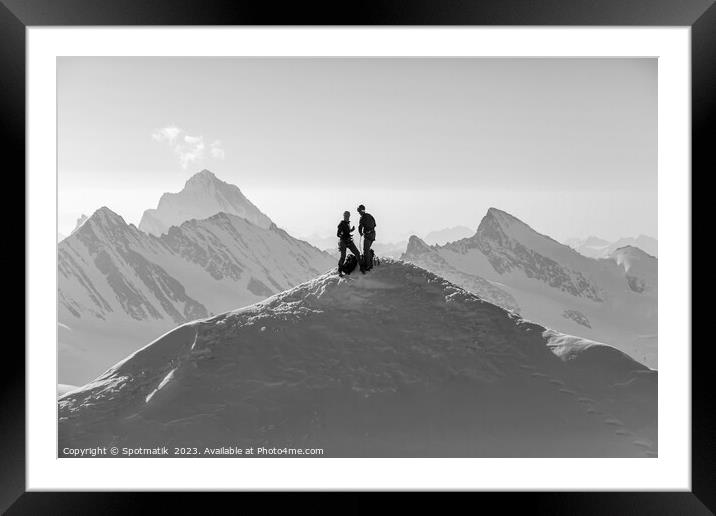 Aerial Switzerland two climbers on snow covered Peak Framed Mounted Print by Spotmatik 