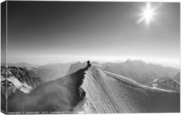 Aerial Switzerland mountaineers on snow covered Peak Europe Canvas Print by Spotmatik 