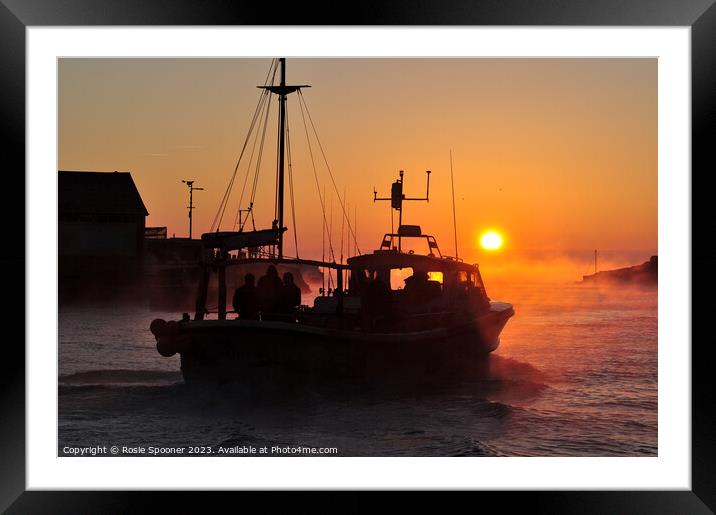 A fishing boat heads out at sunrise Framed Mounted Print by Rosie Spooner