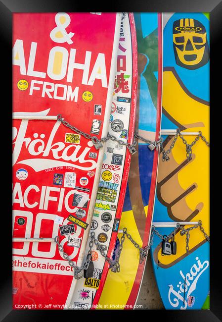 Surfboards lined up in storage at Waikiki Framed Print by Jeff Whyte