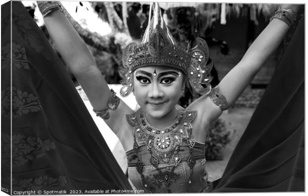 Balinese female dancer performing Ceremonial traditional dance Canvas Print by Spotmatik 