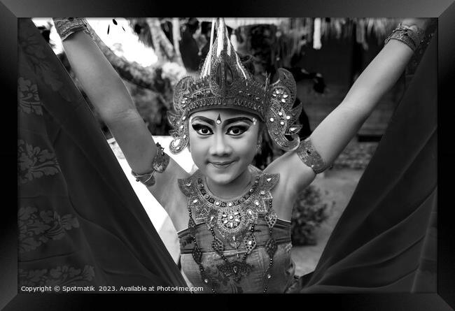 Balinese female dancer performing Ceremonial traditional dance Framed Print by Spotmatik 