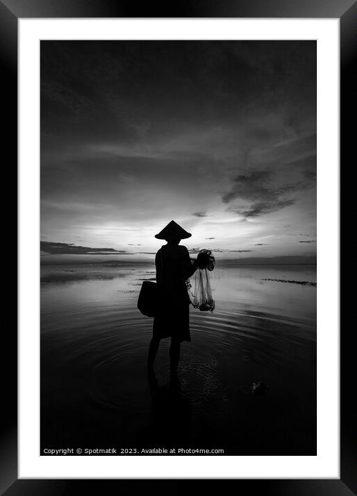Balinese male fishing at sunrise Flores sea coastline  Framed Mounted Print by Spotmatik 