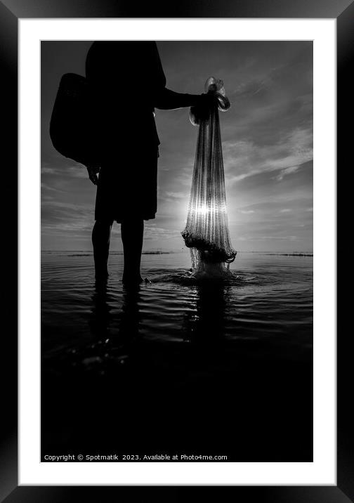 Silhouette Balinese male fishing Indonesian coastline at sunrise Framed Mounted Print by Spotmatik 