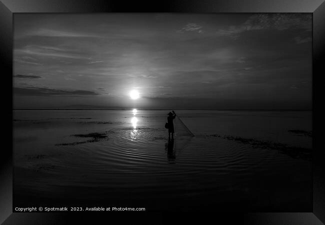 Silhouette Balinese sunrise fisherman casting net Flores sea Framed Print by Spotmatik 