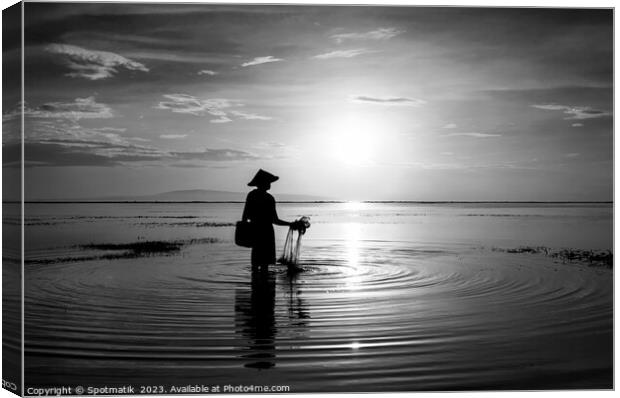 Balinese fisherman at sunrise in Silhouette fishing Asia Canvas Print by Spotmatik 
