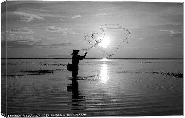 Sunrise Silhouette local Balinese fisherman casting his net  Canvas Print by Spotmatik 