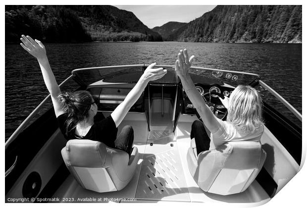 Female partners speeding across Vancouver mountain lake Print by Spotmatik 
