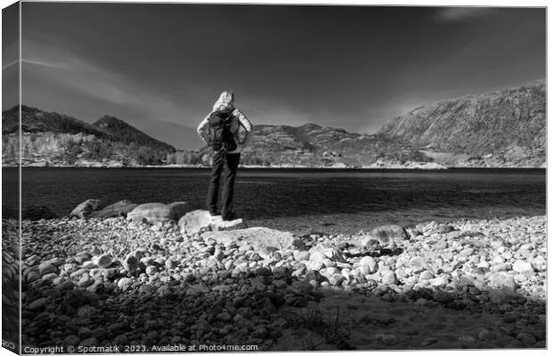 Norway female admiring scenic beauty of Norwegian fjord  Canvas Print by Spotmatik 